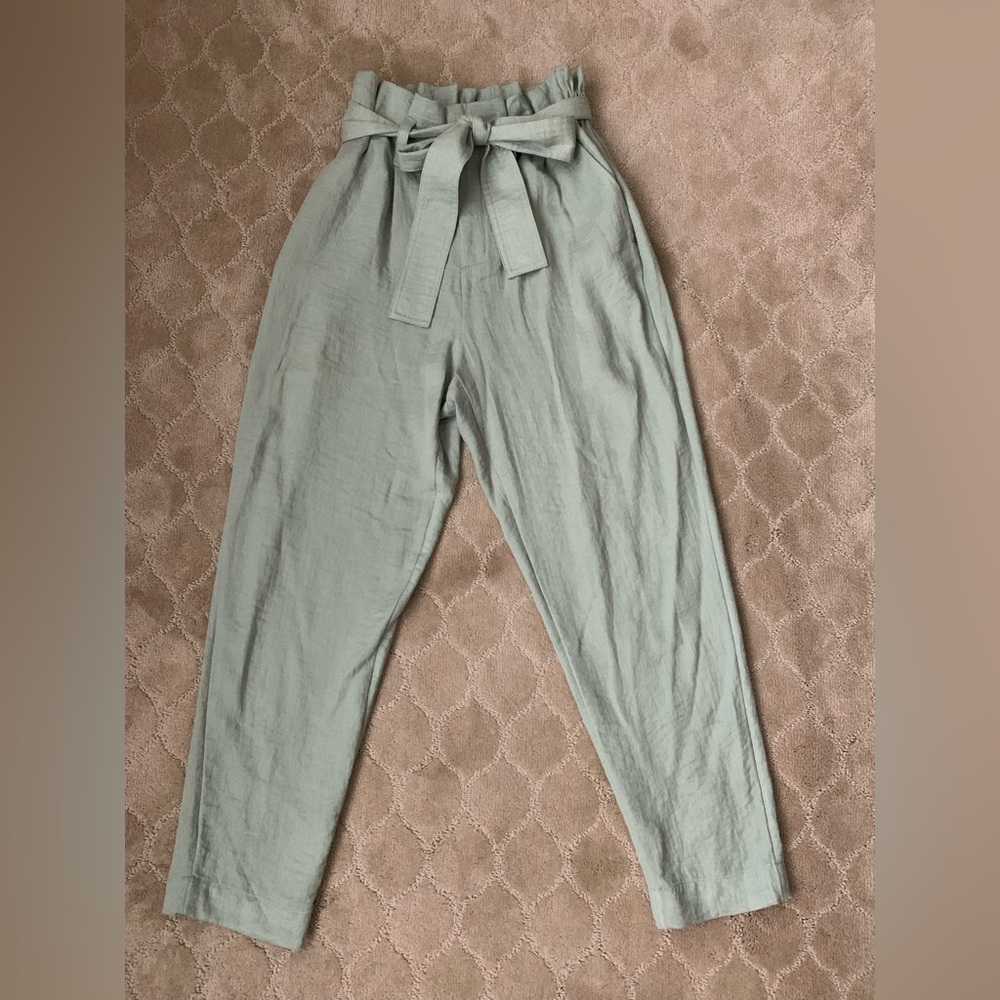 XS sage green linen-type pants with adjustable belt.